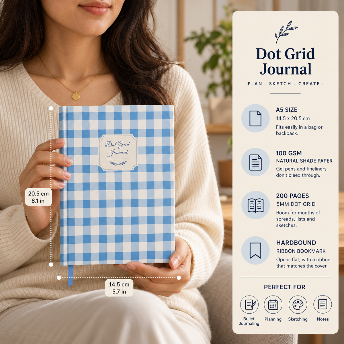 Blue Gingham dot grid journal held by a person