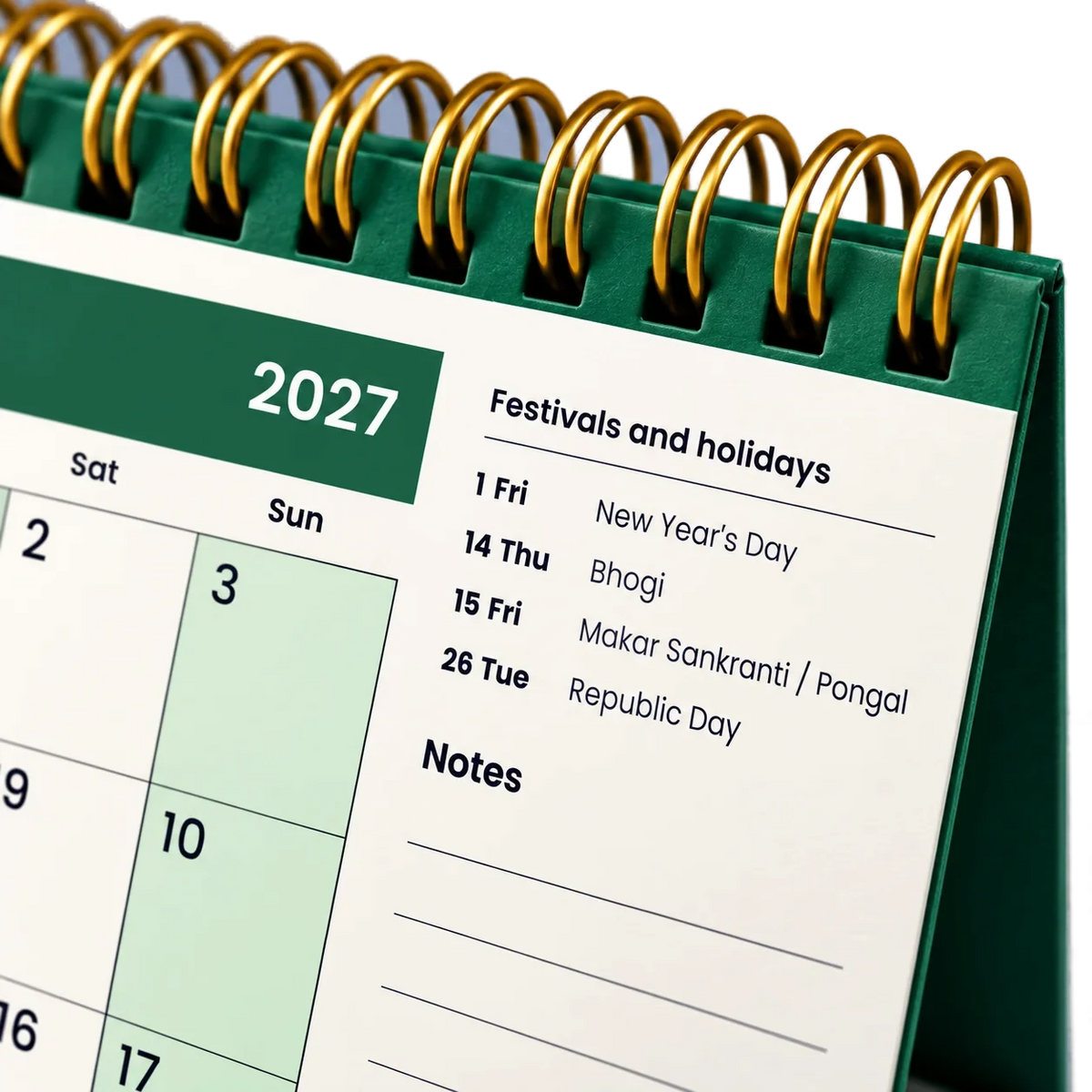 2027 desk calendar in Bottle Green, close-up of the gold wire-o binding, punched holes and festival list