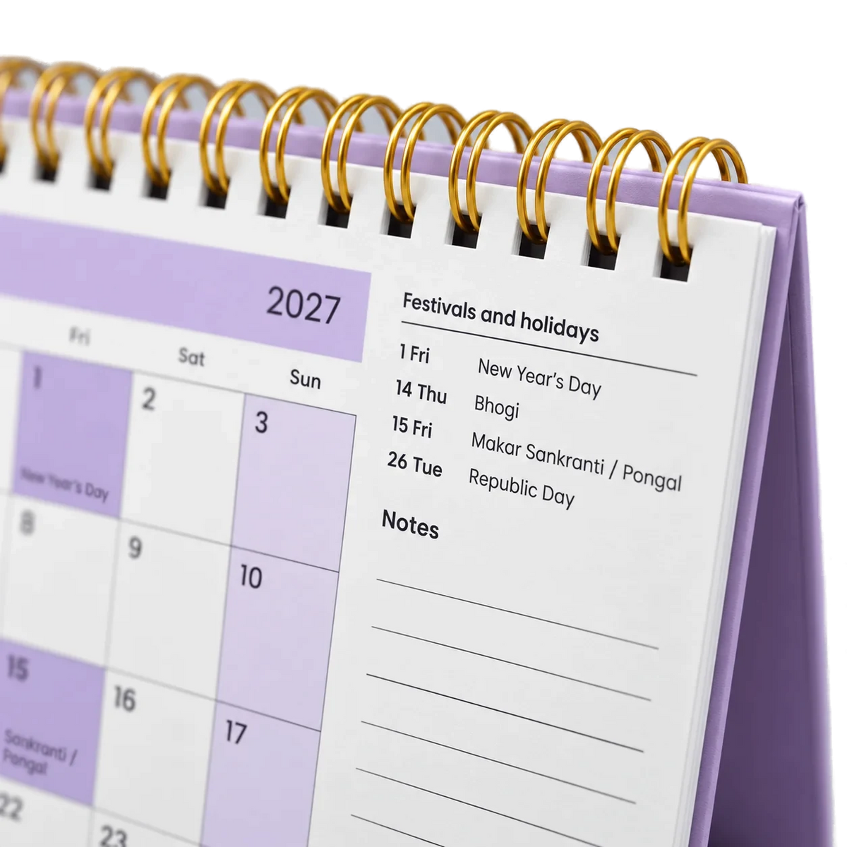 2027 desk calendar in Lavender, close-up of the gold wire-o binding, punched holes and festival list