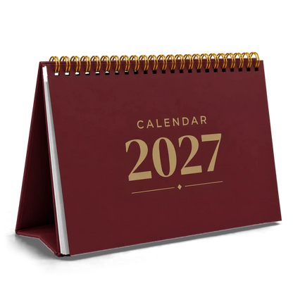 2027 desk calendar in Maroon, A5 landscape tent stand with gold wire-o binding, angled view
