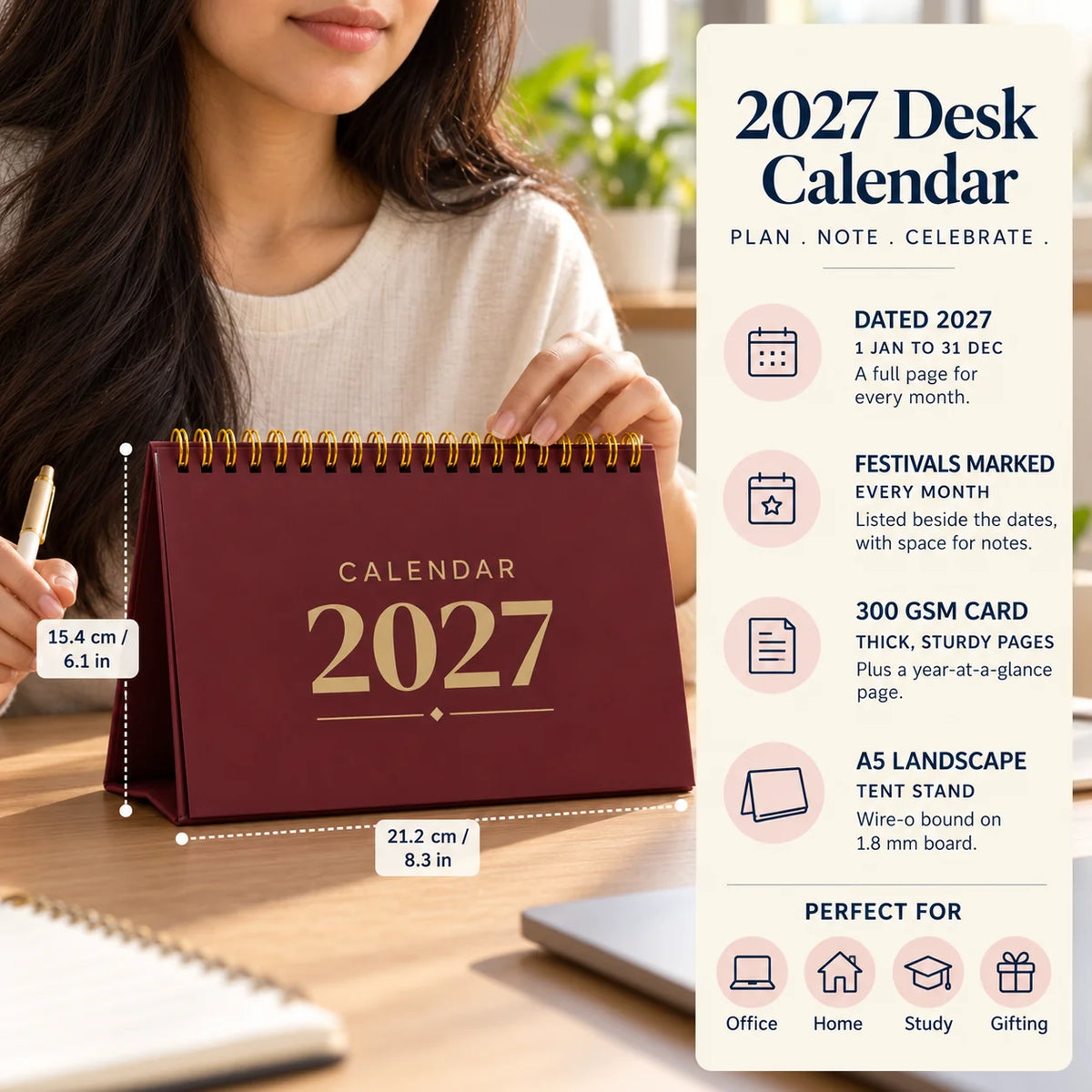 2027 desk calendar in Maroon on a desk with a woman's hand on it, with size and key features