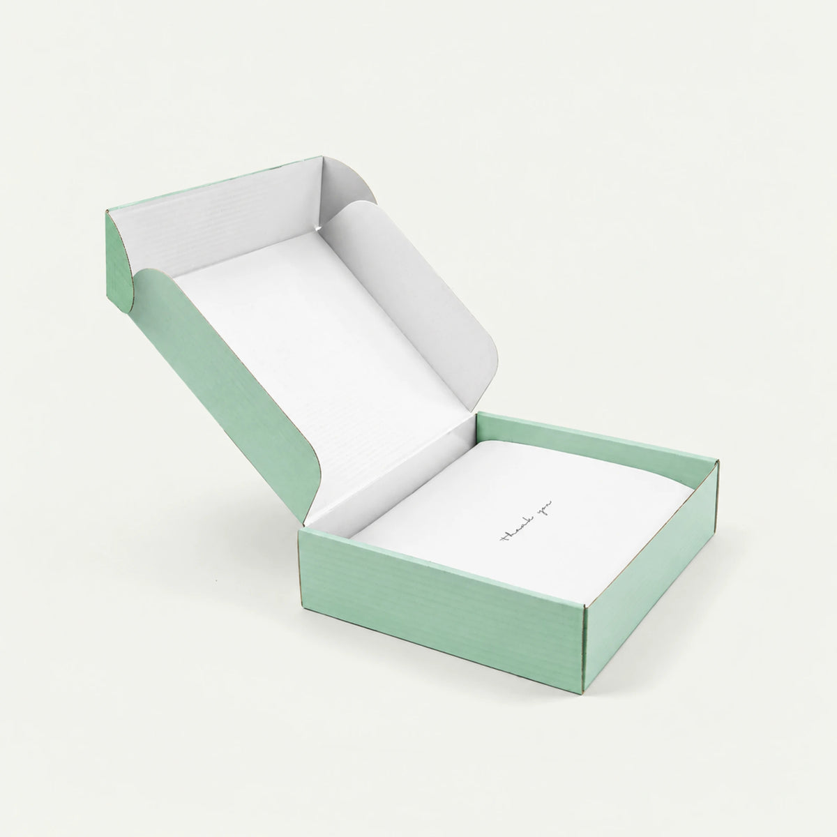 Scribpal gift box packaging in mint green, open with a thank you card